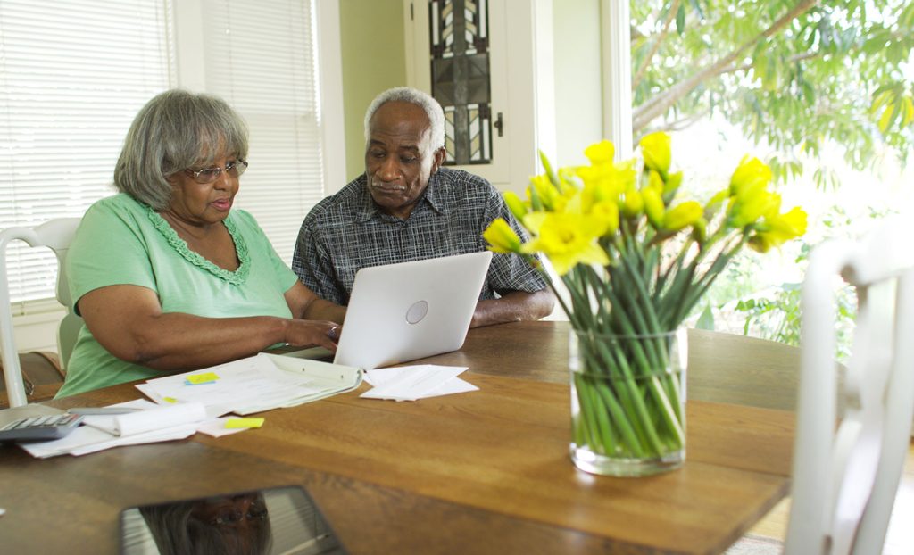 The Gatesworth couple with computer discussing future.