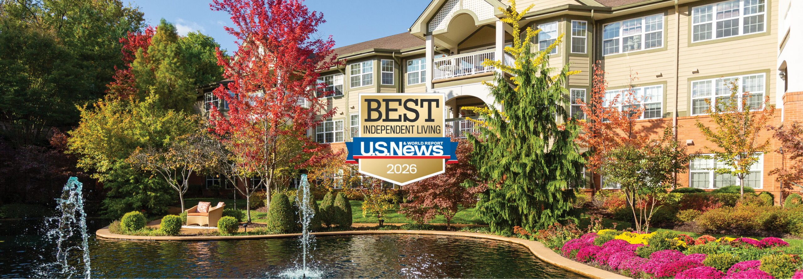 Exterior shot of The Gatesworth with fall colors in the trees.