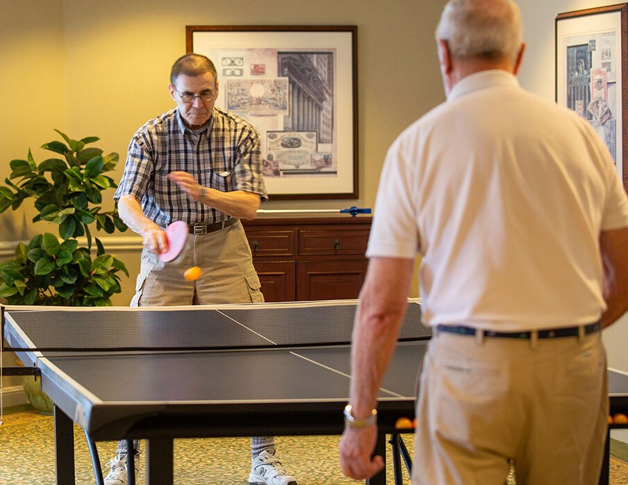 Two residents playing ping pong.