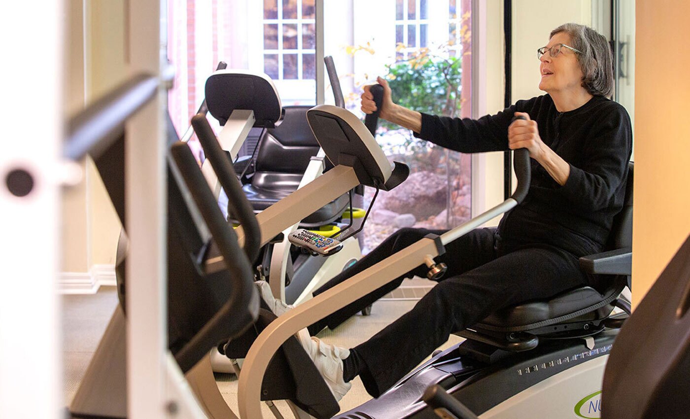 Resident in the gym on exercise machine.