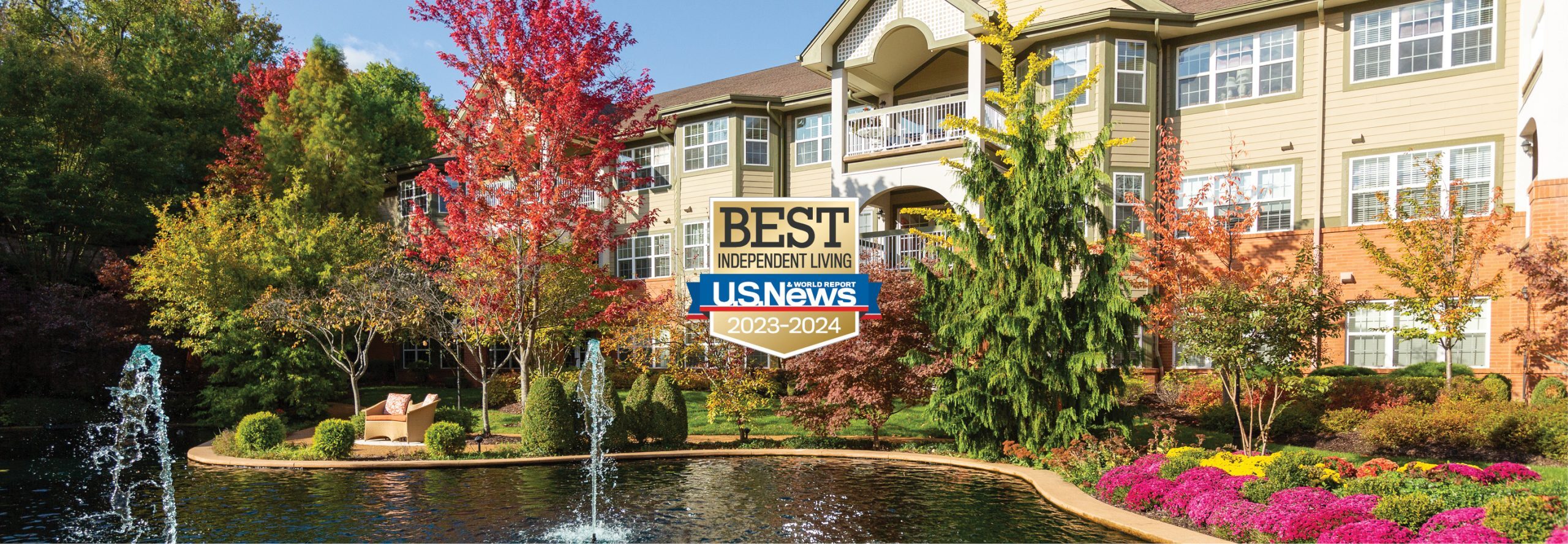 Exterior shot of The Gatesworth with fall colors in the trees.
