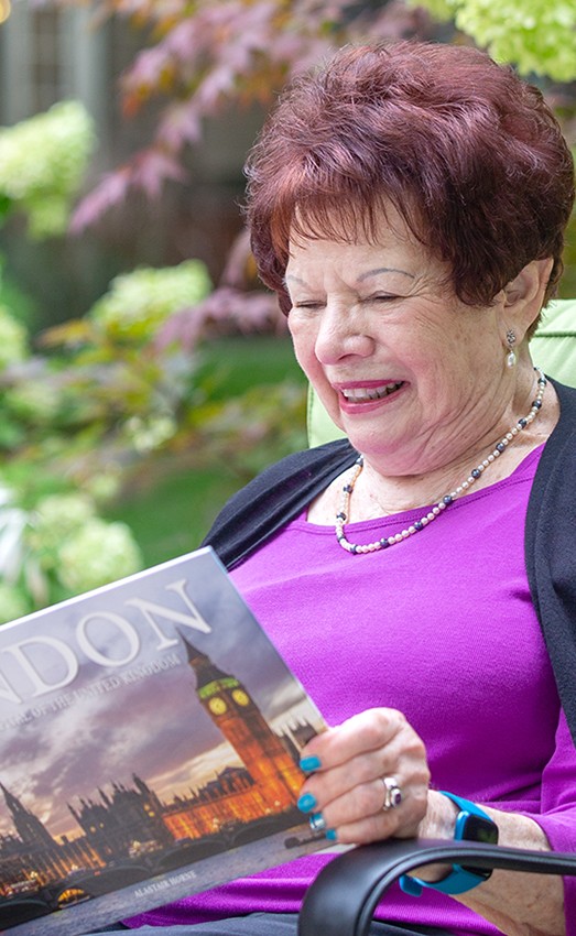 Carol Max reading a book