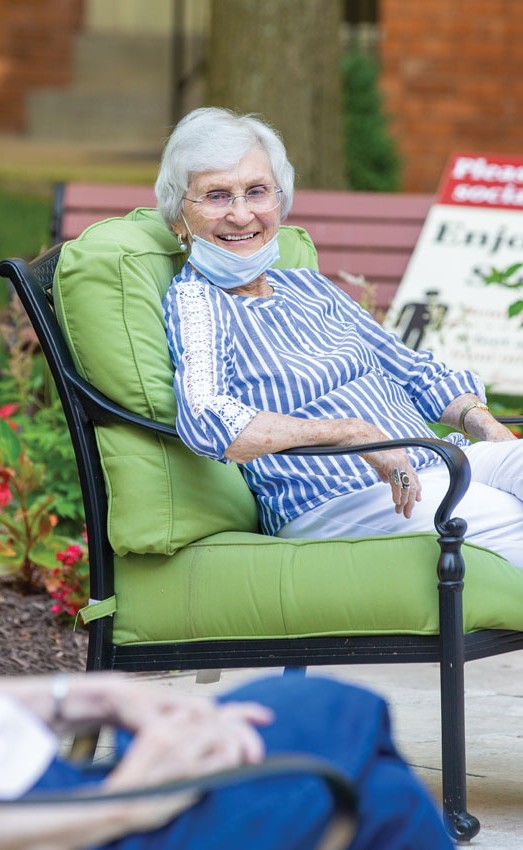 Residents sitting outside while social distancing