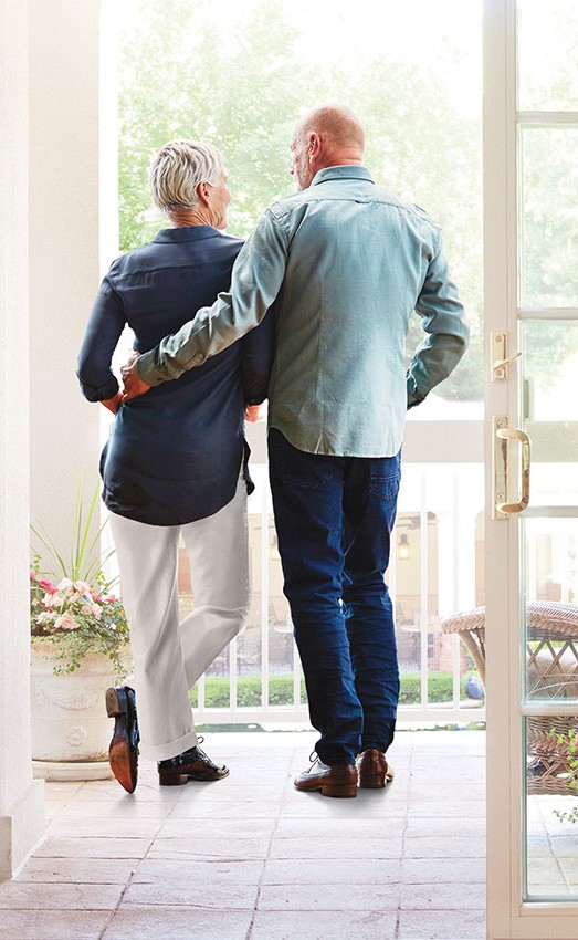The Gatesworth resident couple standing g on the balcony