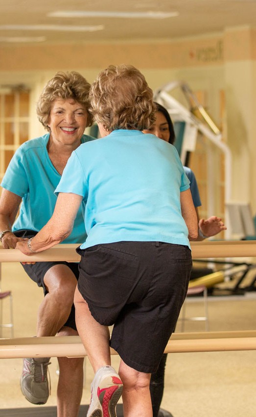 The Gatesworth residents exercising in front of a mirror