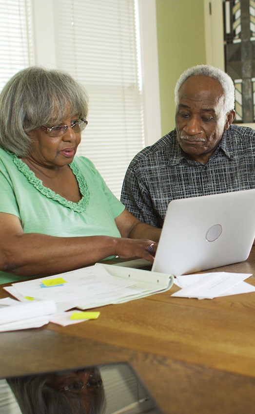 The Gatesworth couple with computer discussing future.