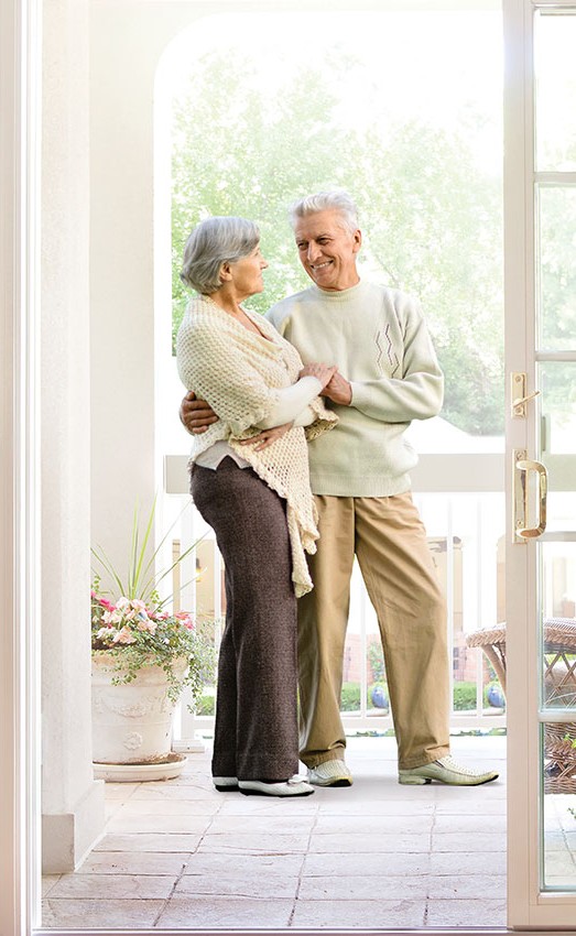 The Gatesworth resident couple embracing on the patio.