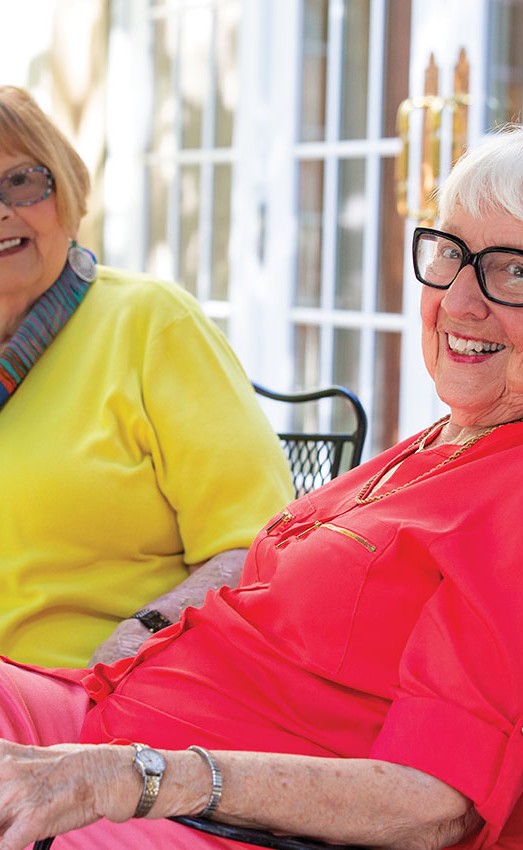 The Gatesworth residents sitting outside with tea.