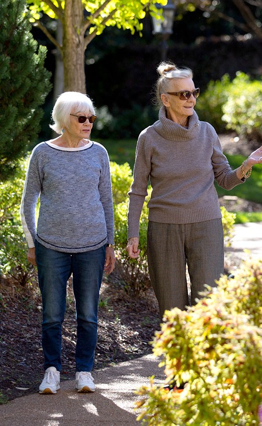 The Gatesworth two residents walking outside admiring the scenery.