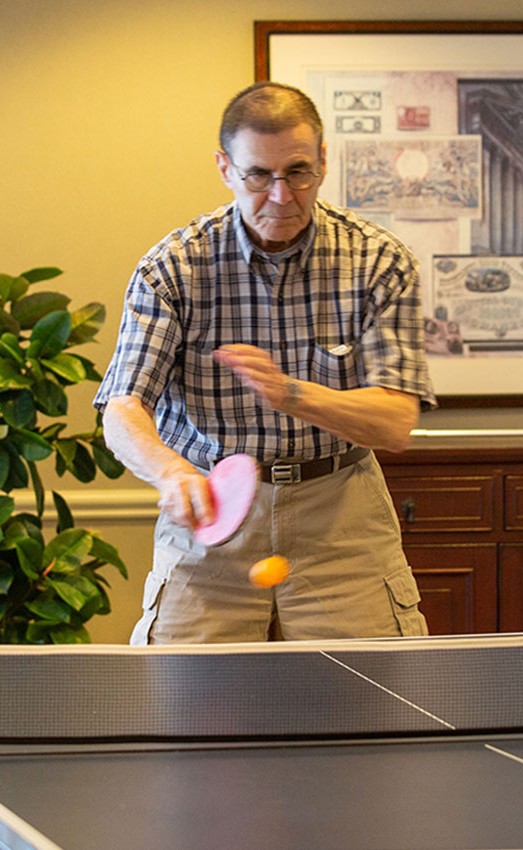 Two residents playing ping pong.