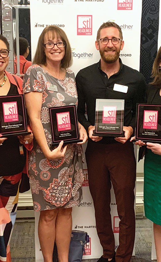 Staff from The Gatesworth pose with STL Headliners plaques.