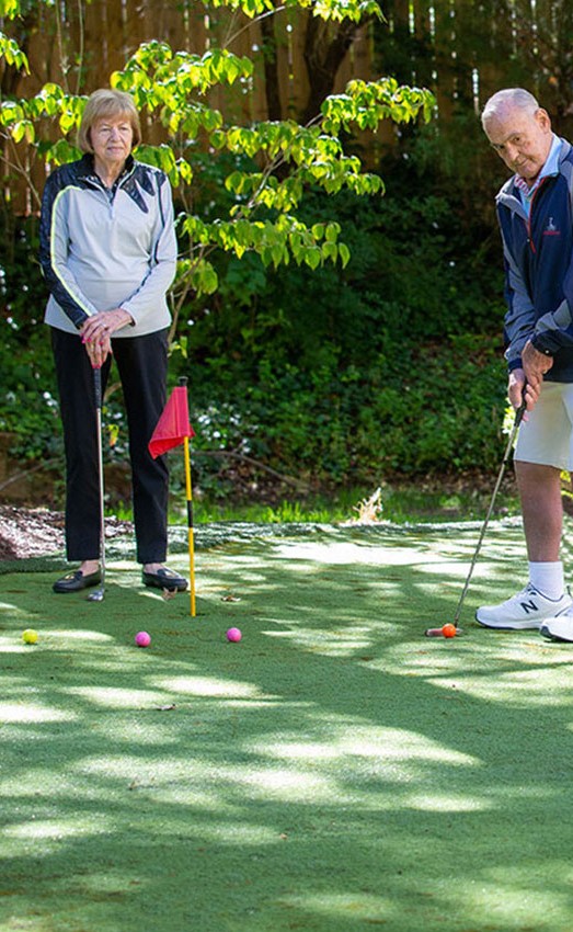 Residents playing on the putting green.