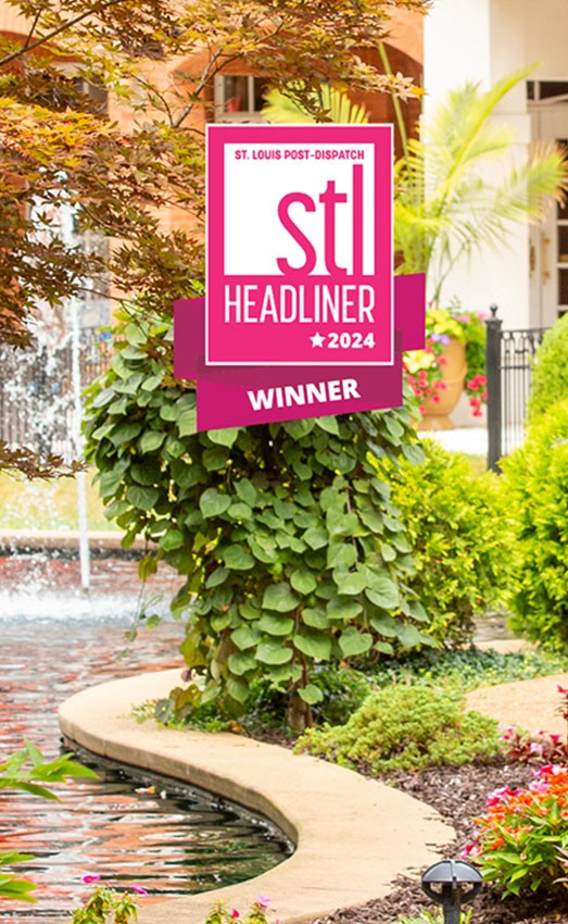 Outdoor seating area with the 2024 STL Headliner award badge.
