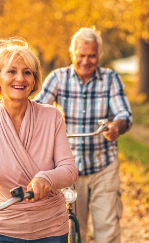 seniors bicycling in autumn