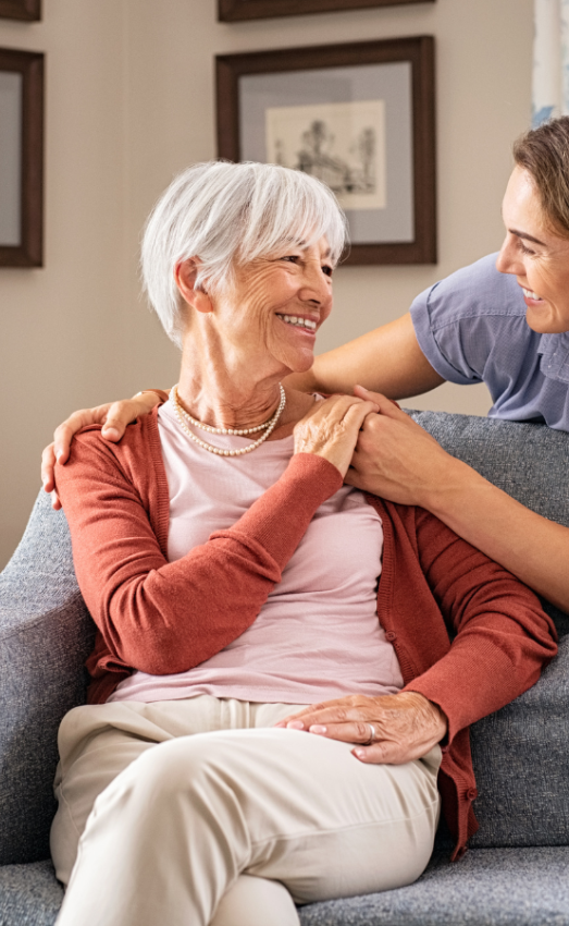 older woman and nurse in a senior apartment