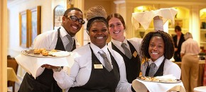 The Gatesworth wait staff posing with food.