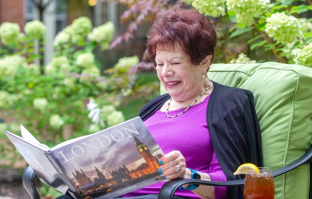 Carol Max reading a book