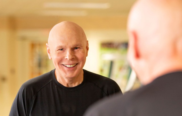 Mens health resident looking in the mirror.