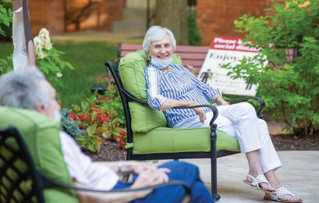 Residents sitting outside while social distancing