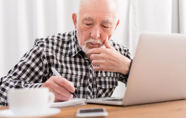 Man writing in notebook