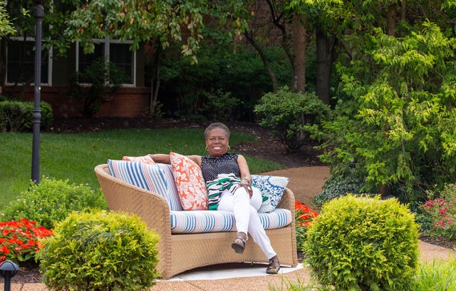 The Gatesworth Dr. Pasley sitting outside next to pond.