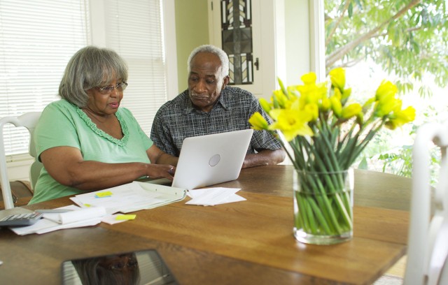 The Gatesworth couple with computer discussing future.