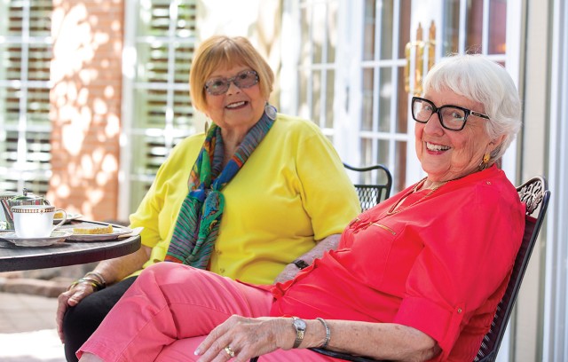 The Gatesworth residents sitting outside with tea.