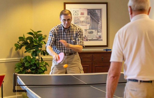 Two residents playing ping pong.