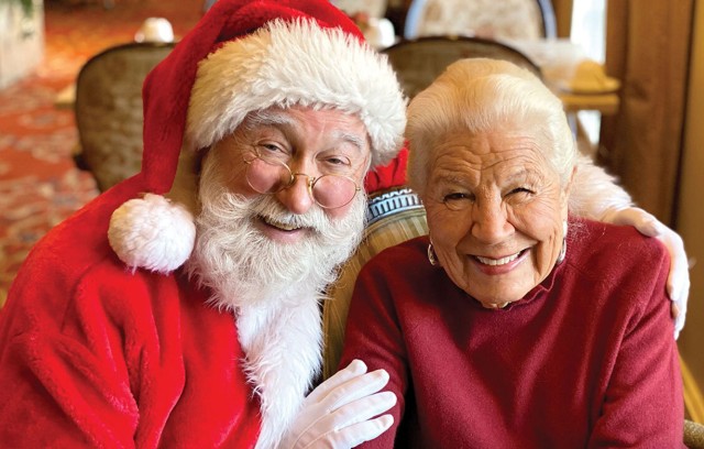 The Gatesworth resident smiling with Santa Claus.