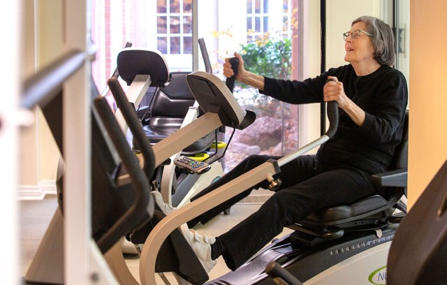 Resident in the gym on exercise machine.