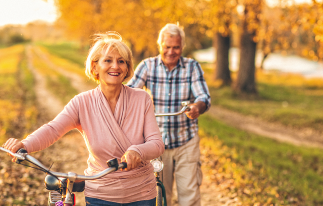 seniors bicycling in autumn