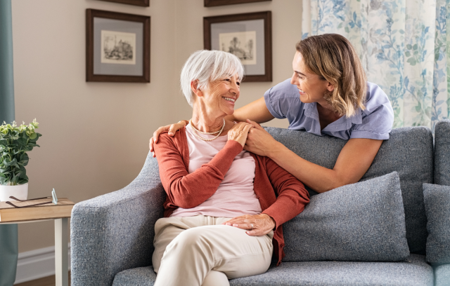 older woman and nurse in a senior apartment