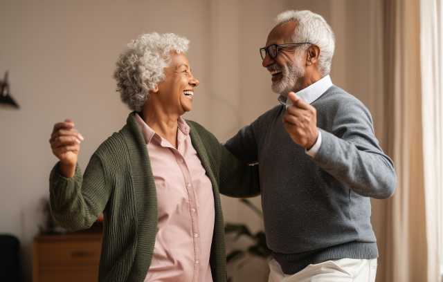 senior couple dancing in their home