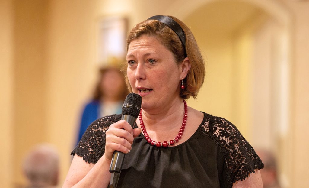 Stacy Muehlher speaking at breakfast