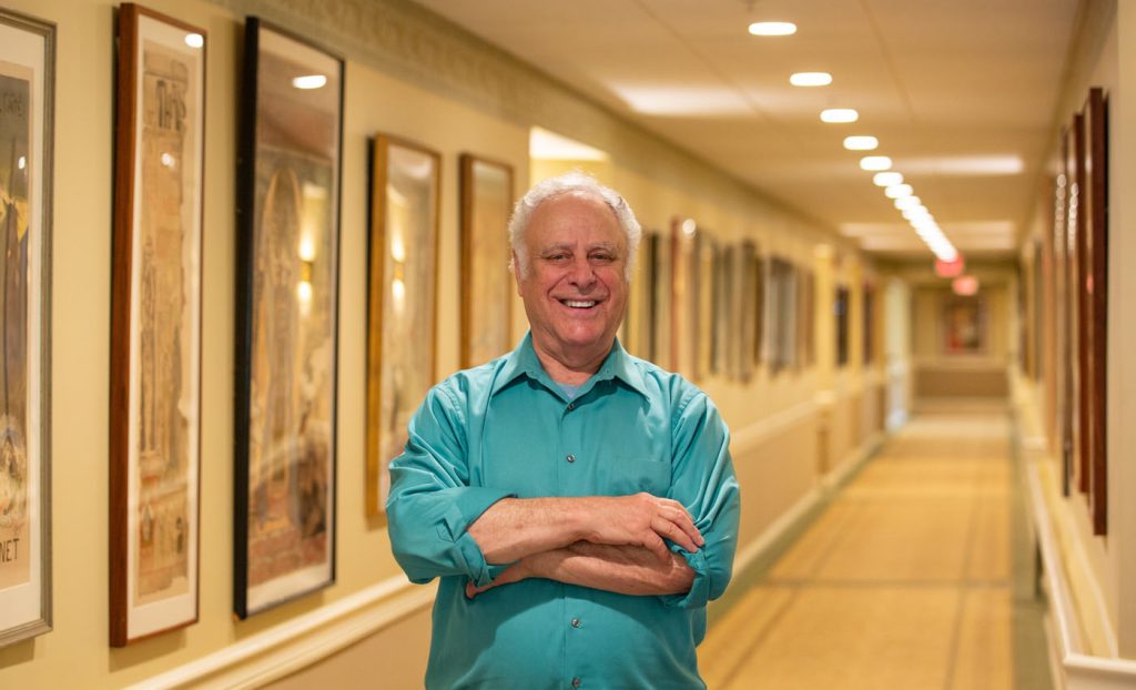 John Lesser with his posters