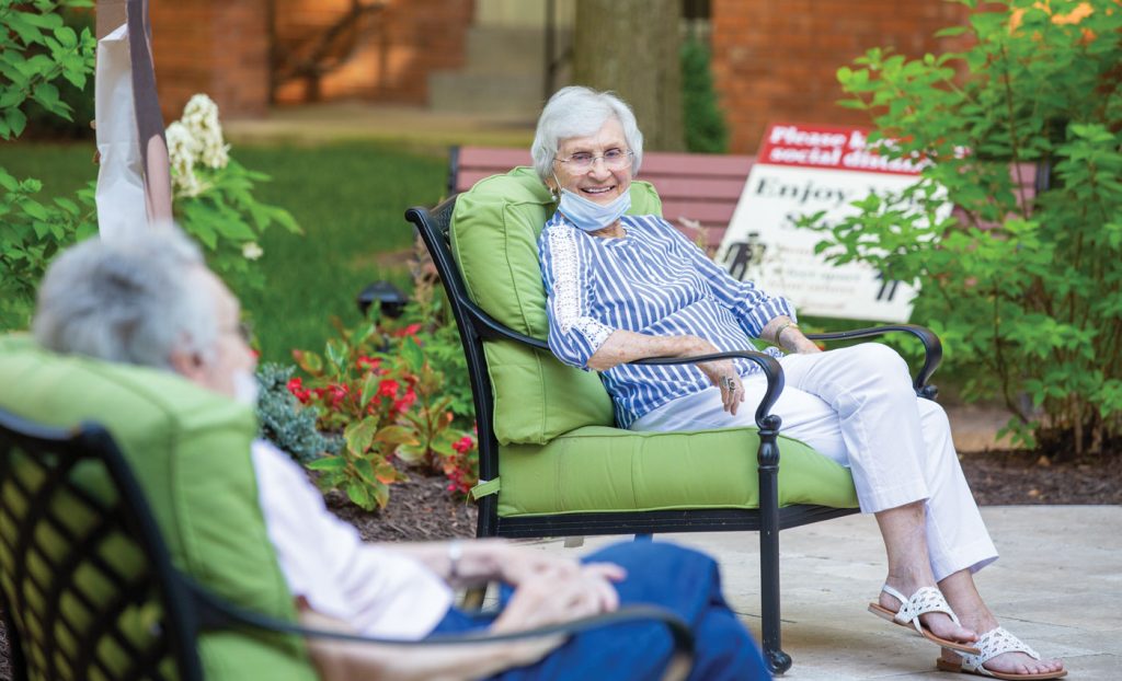 Residents sitting outside while social distancing