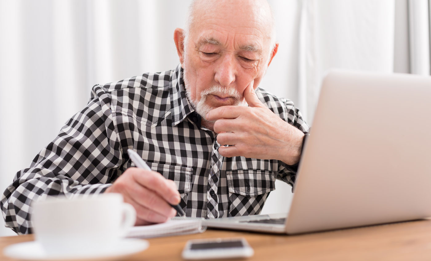 Man writing in notebook