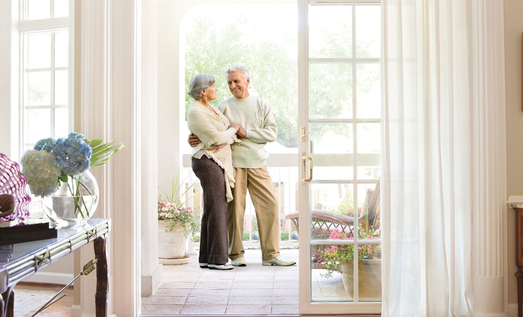 The Gatesworth resident couple embracing on the patio.