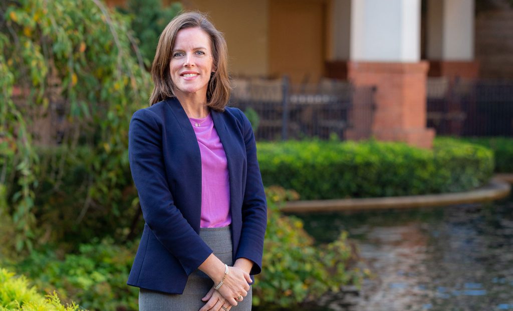 The Gatesworth Carrie Montrey outdoors next to pond.