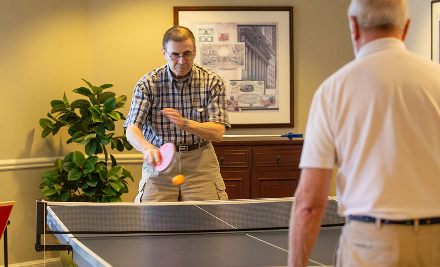 Two residents playing ping pong.