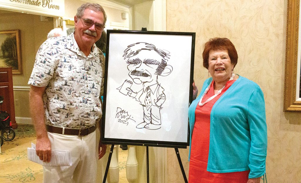 Posing with a drawing.