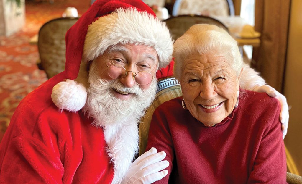The Gatesworth resident smiling with Santa Claus.