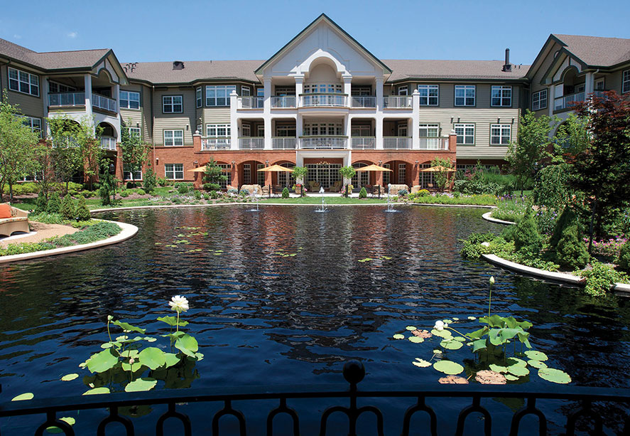 Exterior of The Gatesworth overlooking a pond.