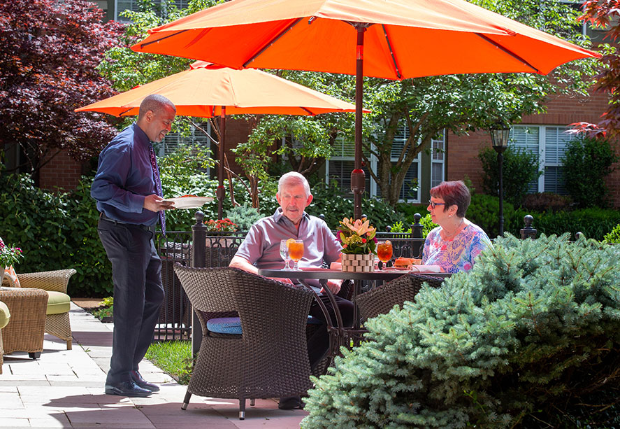 The Gatesworth residents dining outdoors.