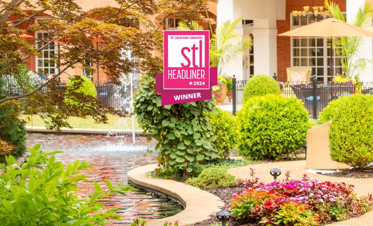 Outdoor seating area with the 2024 STL Headliner award badge.