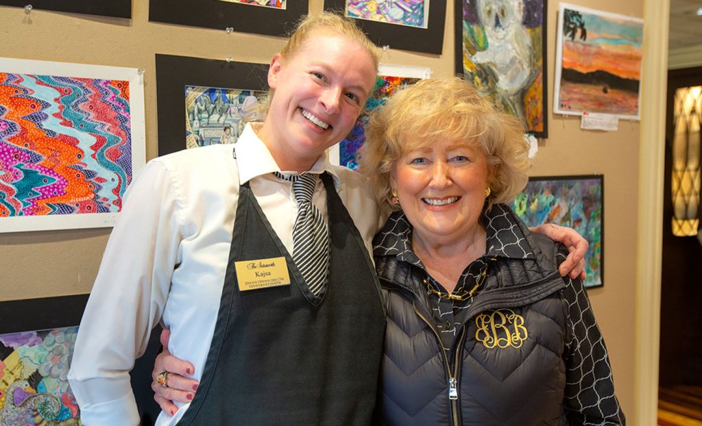 Kajsa Holton with a resident smiling.